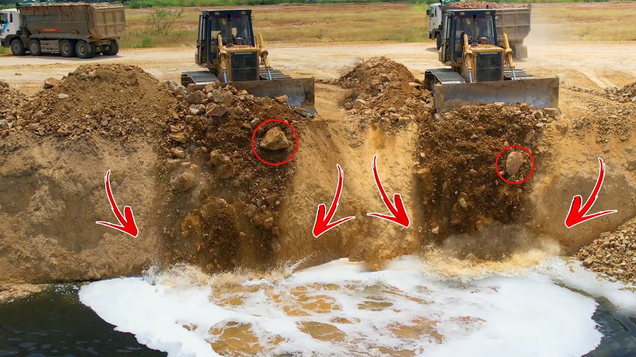 Incredible Skills Bulldozers to push the soil into the lake with trucks worked together to dump soil