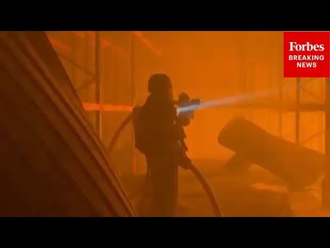 RAW VIDEO: Ukrainian First Responders Deal With Aftermath Of Russian Strikes On Kyiv, Ukraine