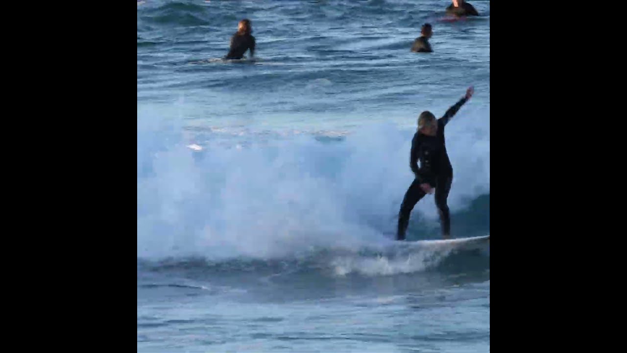 Surfers at Duranbah beach in Tweed Heads, New South Wales 