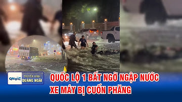 Quốc lộ 1 bất ngờ ngập nước, xe máy bị cuốn phăng | QNgTV