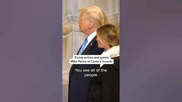 Trump arrives and greets Mike Pence at Carter's funeral
