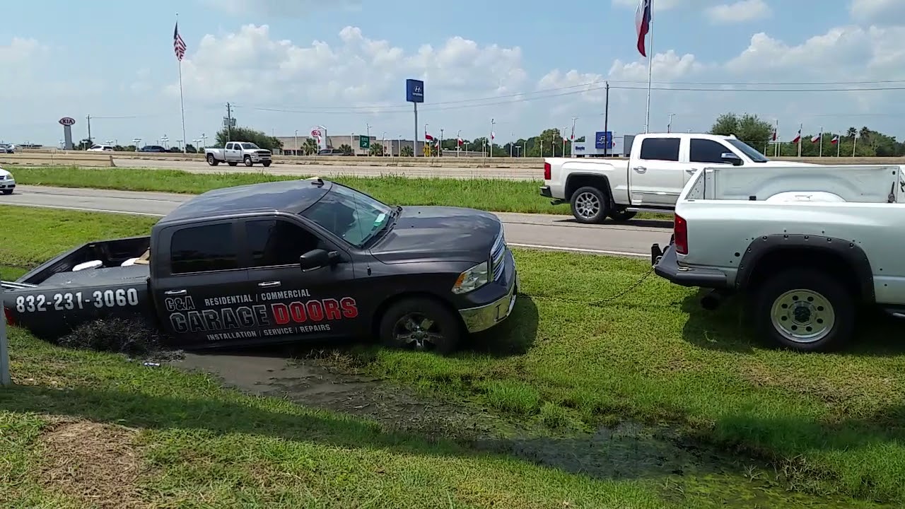 Cummins pulling out stuck truck - YouTube