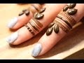 Simple leafy henna design on fingers by henna ckg