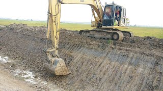 Excavator Cat 320L Are Digging Clearing Canal 