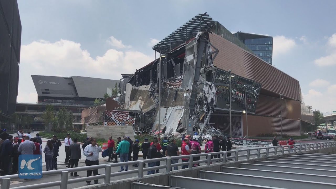 Bystanders Gather Around Collapsed Shopping Mall in Mexico City