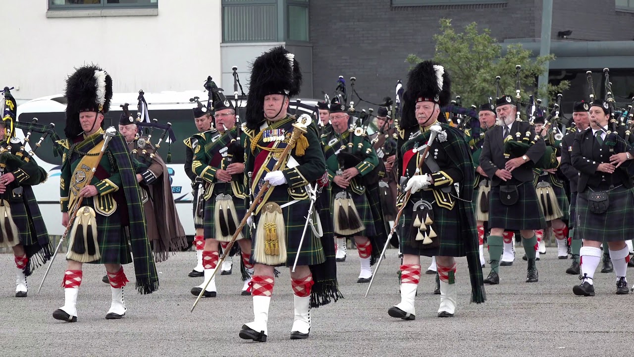 Drum Majors lead the Pipes and Drums on the march at Gordon Barracks ...