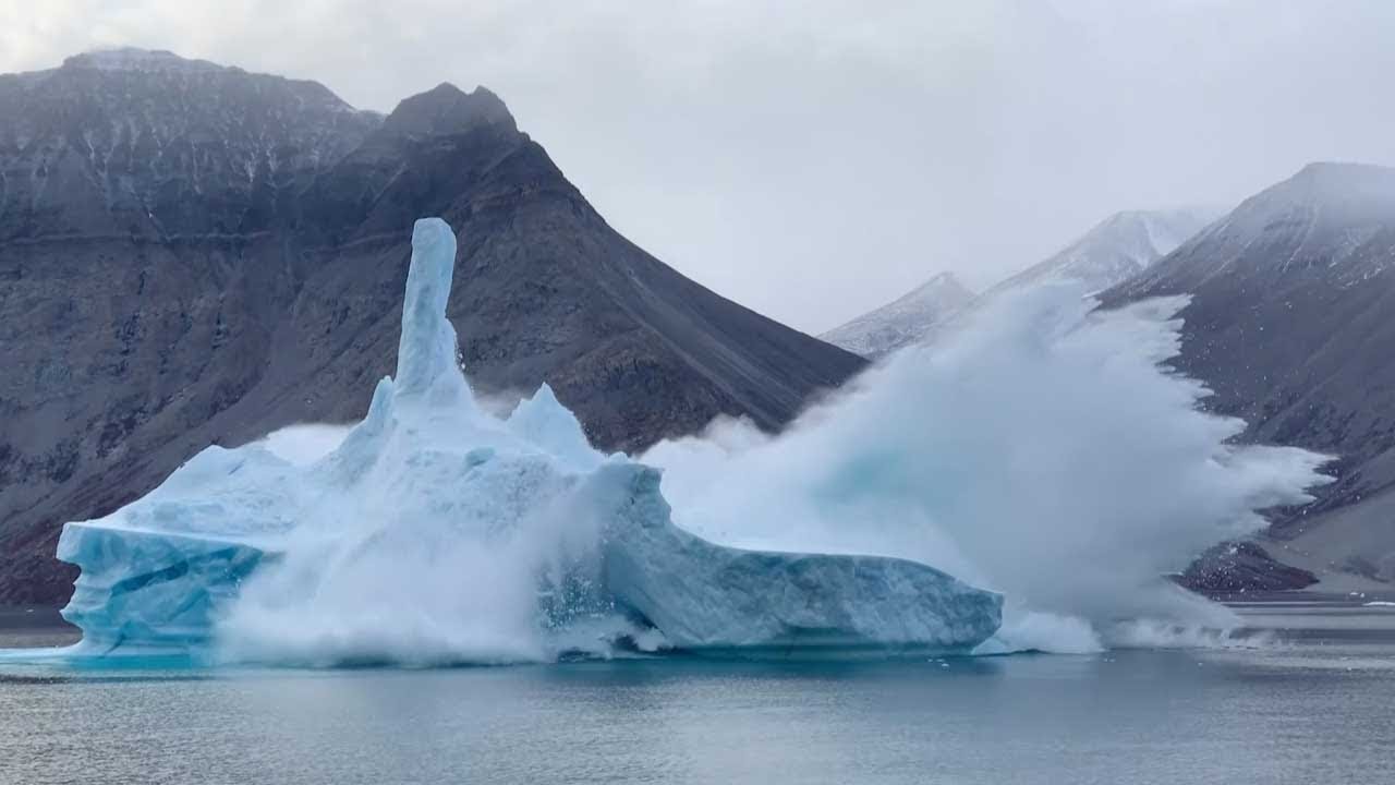 Huge Iceberg Falls To Pieces - YouTube