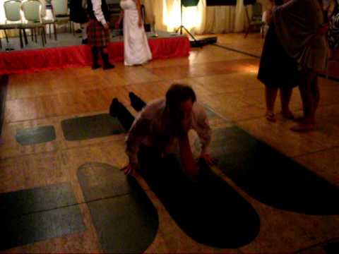 Drunk man does the worm and almost hits bride