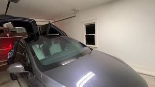 Tesla Model X falcon wing doors vs. standard sized garage demo open & shut.