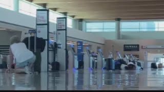 Police: Woman opened fire in Dallas airport; cop shot her