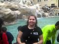 Tossing a coin into the trevi fountain