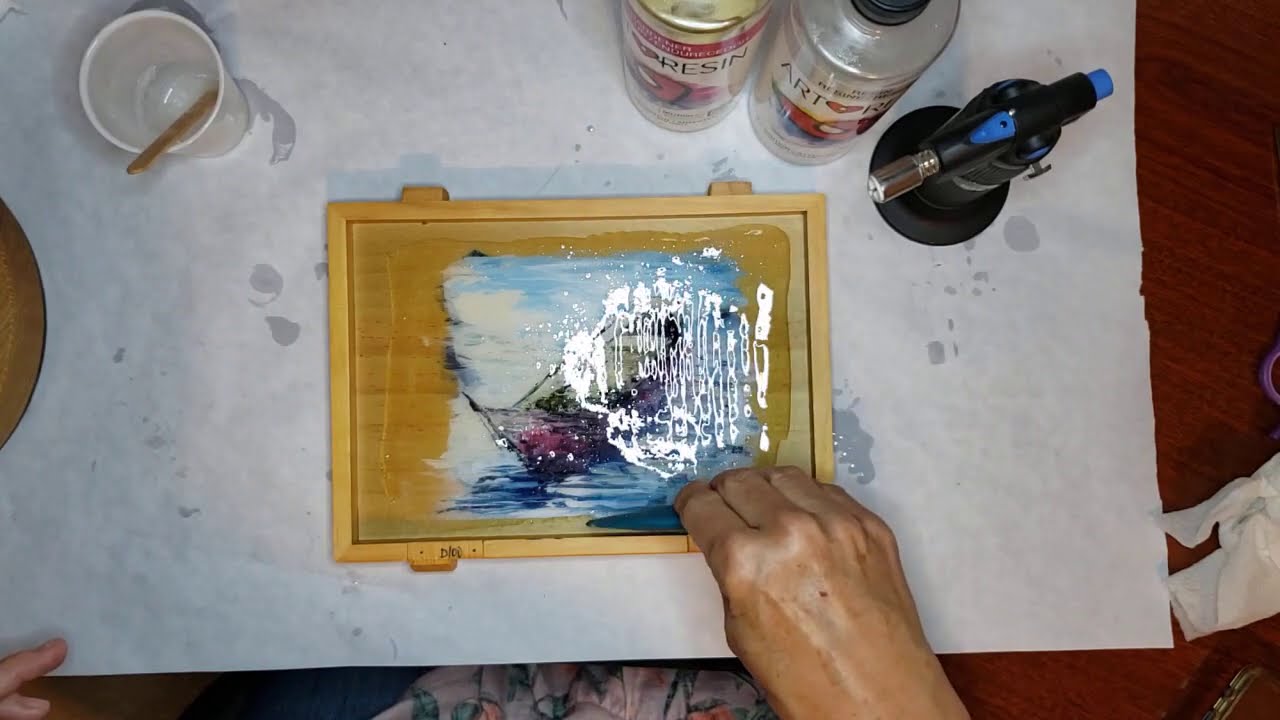 Resining a sailboat and canoe painting on a cigar box (2 of 3)