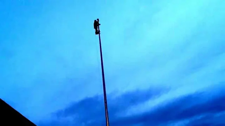 Flagpole climbing at dawn. Seventy mile drive, fifty foot pole, only 24 degrees at 6am. Priceless.
