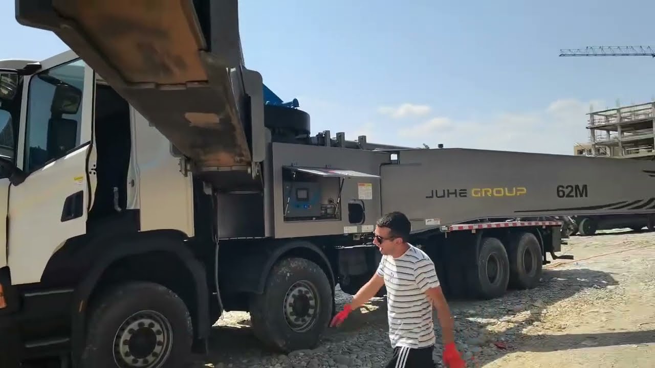 Jiuhe concrete pump trucks at a construction site in Georgia.