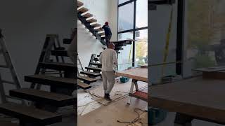 Floating stairs installation. 4” treads, switch back system. #customhome #luxuryhomes