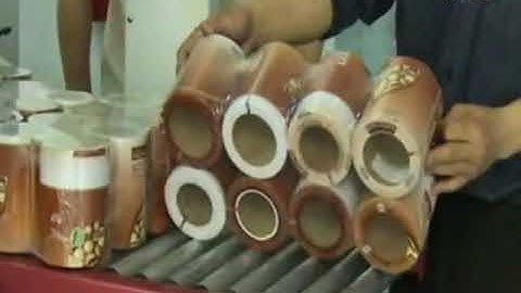 Automatic sleeve shrink wrapping machine for paper rolls tapes