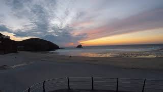 Portreath Beach Cornwall with red and orange sky.