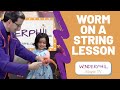 Teaching twisty worm on a string magic trick