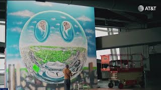 Meet the Atlanta artist behind the chrome reflective smiley face mural