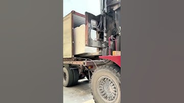 Giant stones are precisely unloaded by a forklift! The industrial handling scene is incredibly