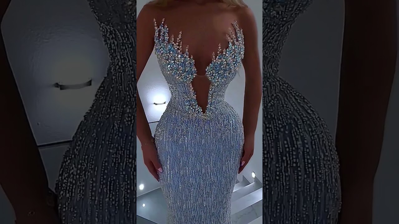 To order this ice blue crystal dress DM An illusion couture gown in a soft ice blue tone, designed
