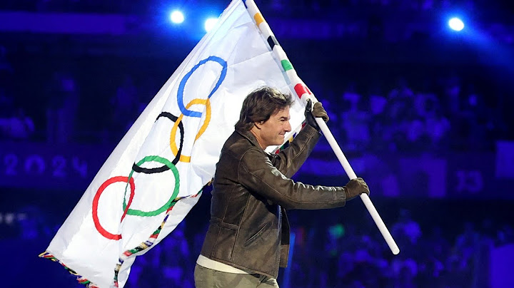 Tom Cruise descends from stadium roof in daring Olympic finale