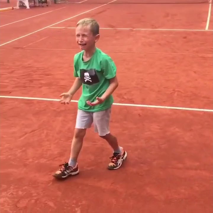 Kid is crying after losing match