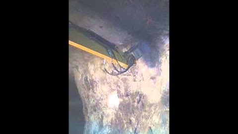 Alpine Rotary Scaling Attachment.  Drill and Blast Scaling in Underground Limestone Mine