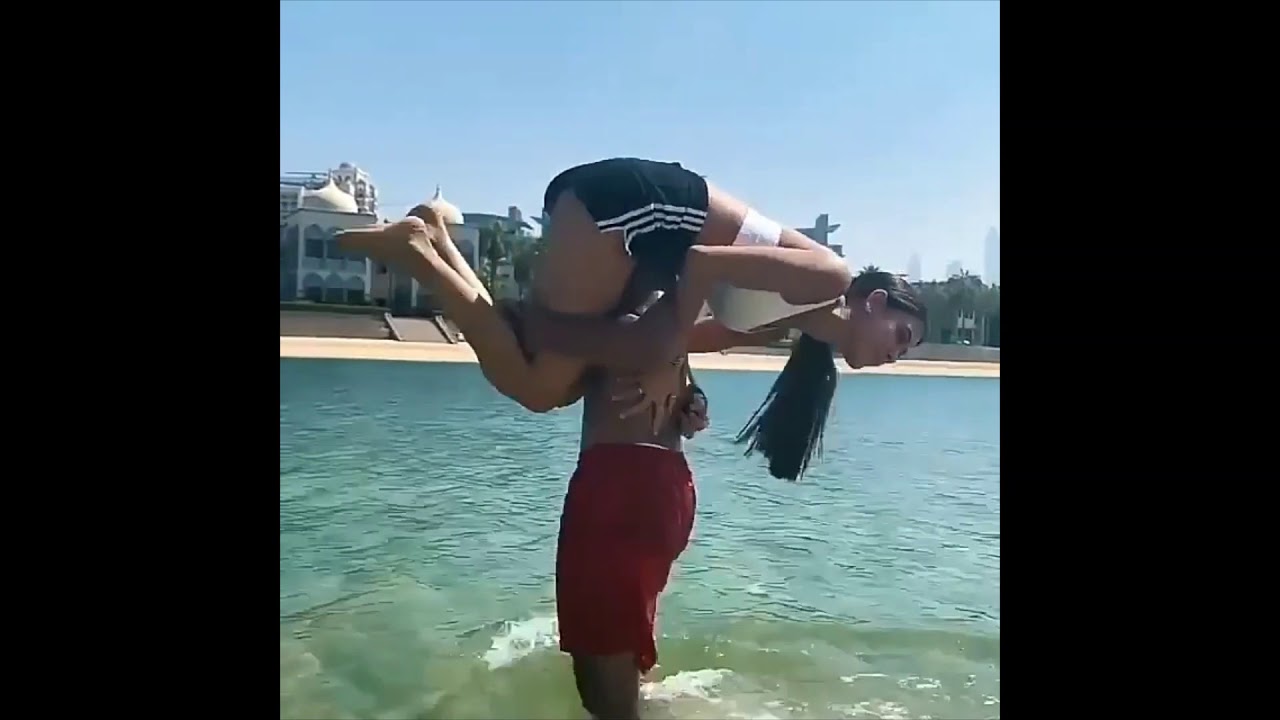 Sabina Hidalgo and Bailey May playing football on a beach in Dubai, UAE  October 2020 NOW UNITED