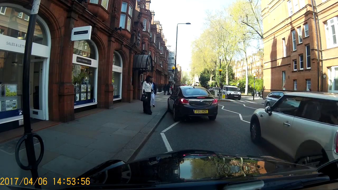 Minicab pickup on zigzags FG12 WZN