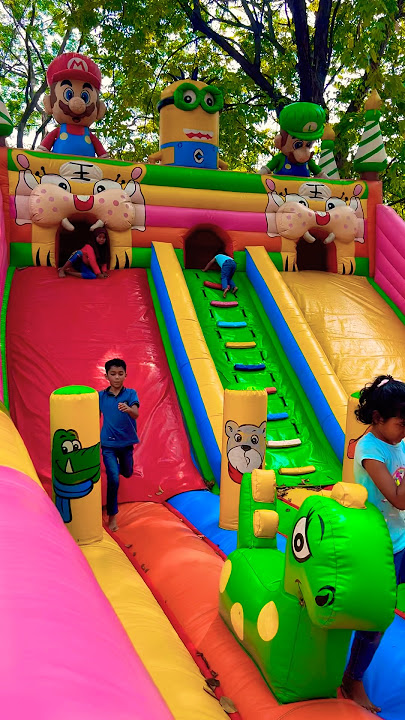 Run around on the cute green crocodile balloon palace slide ride