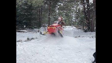5 Y.O. Girl on Polaris 120 Snowmobile jumping and turning some laps