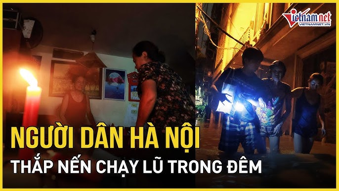 Hà Nội: Nước lũ dâng cao, người dân thắp nến chạy lũ trong đêm, căng mình đối phó | Báo VietNamNet