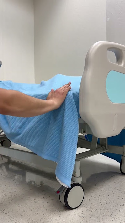 Making a mitered corner #nurse #nursing #bedmaking #nursingschool #nursingstudent #medical #shorts