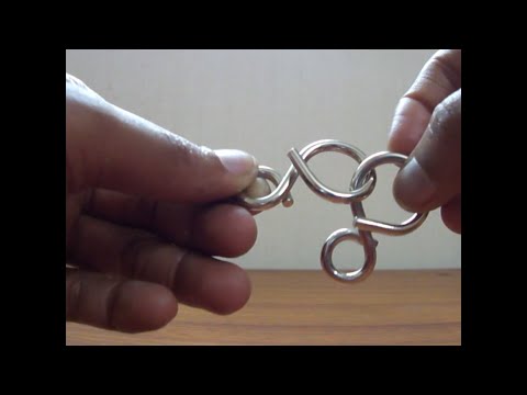 Solution to 8 shaped Metal Ring puzzle