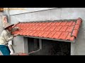 Construction of terracotta tiles on the roof of the window  building a beautiful window roof