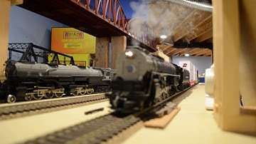 3rd Rail Niagara w/PS2 pulls out with freight & train meet