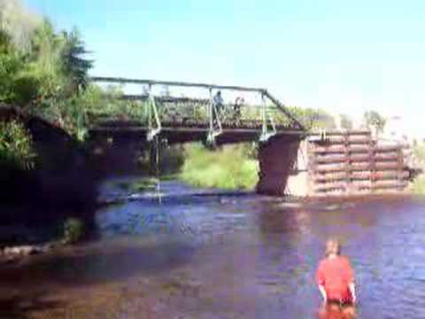 Nadine jumping into river from bridge