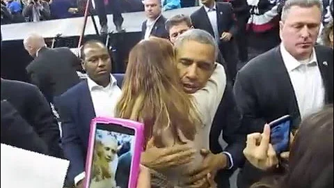 The President of the United States hugs Joyce Peck