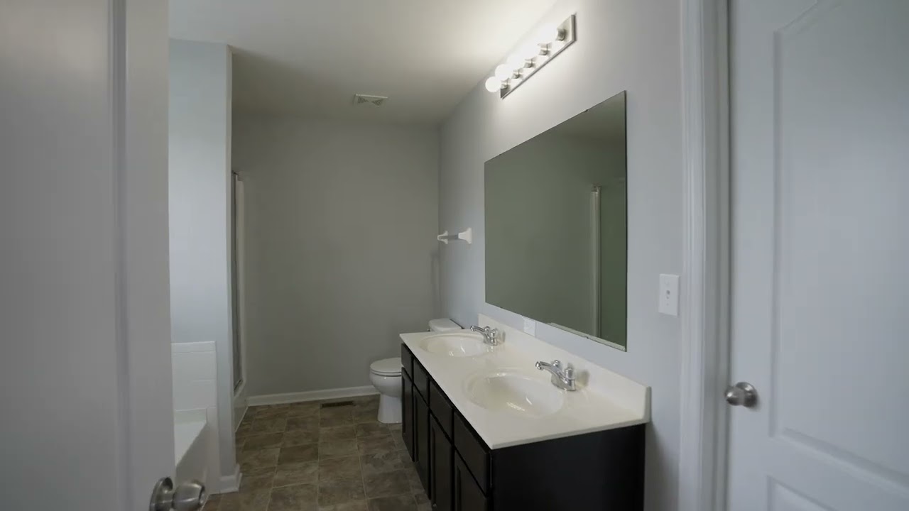 Charming 4-Bed Home w/ Walk-Out Basement, Stainless Kitchen & Primary Suite Retreat!