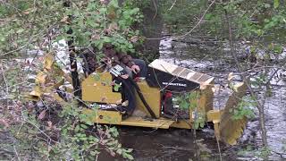 Struck - MAGNATRAC MH4900 small bulldozer, going through a swamp.