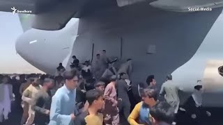 Desperate Afghans Cling To U.S. Military Plane To Flee Taliban