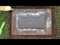 Cleaning a Bronze Grave Marker in the Kirkland, WA, Cemetery