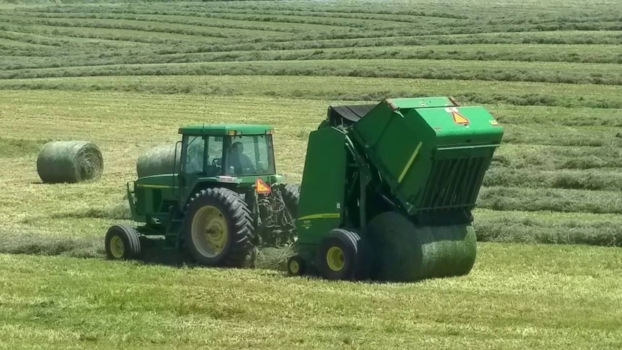 Kids John Deere tractor and hay bale
