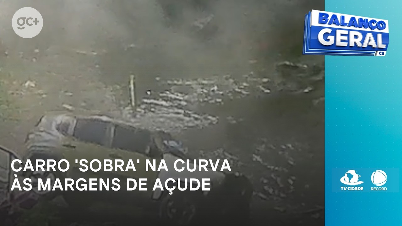 Carro 'sobra' na curva e cai 'de bico' em açude