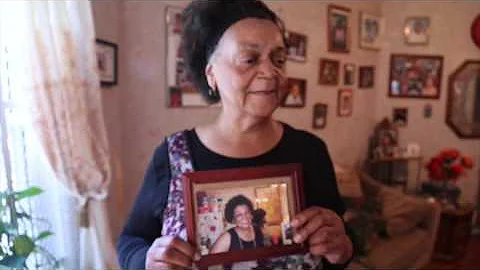 Beatrice Cole shows bullet damage in her home