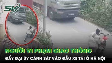 Rùng mình khoảnh khắc người đàn ông đẩy CSGT vào ô tô đang chạy