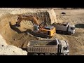 Liebherr 974 Excavator Loading Trucks