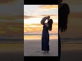 Grateful for blessings: family joy by the sunrise at the beach