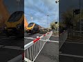 Ritchie catching a glimpse of a Cross-Country Voyager at Bentley Heath level crossing
